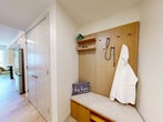 Located in San Diego, CA 92123, this thoughtfully designed 2-bedroom, 1-bathroom residence offers a compact yet highly functional single-level layout. Light wood flooring runs throughout, creating a warm and cohesive aesthetic that unifies each room.

The galley-style kitchen is a standout feature, outfitted with crisp white upper cabinetry, light wood lower cabinets, stone countertops, and a full suite of stainless steel appliances including a built-in oven, electric cooktop, over-range microwave, and refrigerator. Recessed lighting and subway tile backsplash add a clean, modern touch, while the open sightline to the hallway and living area enhances the sense of space.

Both bedrooms are cozy and well-appointed, featuring clean white walls, wall-mounted lighting, and framed artwork. The primary bedroom benefits from a sliding glass door that opens to an adjoining space, adding visual depth and connectivity. Each room is designed for restful comfort with an understated, contemporary style.

The bathroom is bright and neatly finished, featuring a light wood vanity with ample counter space, a combined tub and shower with a curtain enclosure, and the same warm wood-tone flooring found throughout. A central hallway connects all rooms efficiently, completing this well-organized and modern San Diego residence.