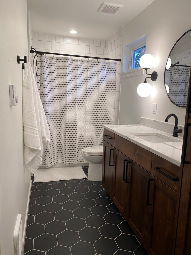 Full bathroom with stacked W/D - 1238 NE Jones Rd