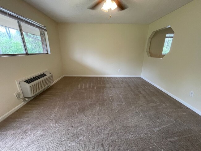 Building Photo - One bedroom End-Unit in quiet Camelot Vill...