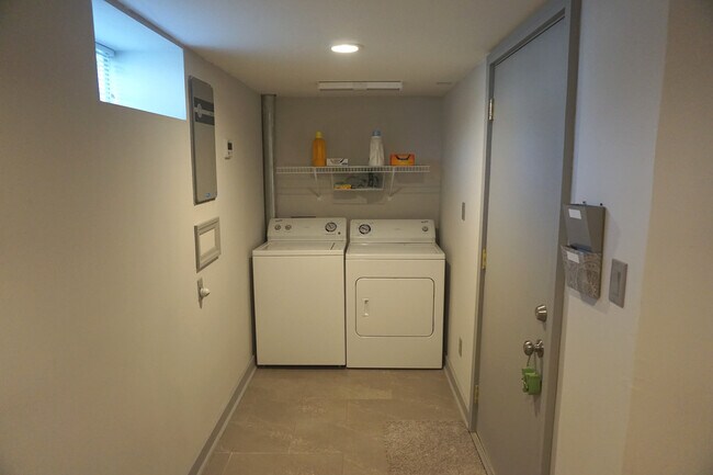 A laundry room is available near unit entryway. - 920 Morehead Street