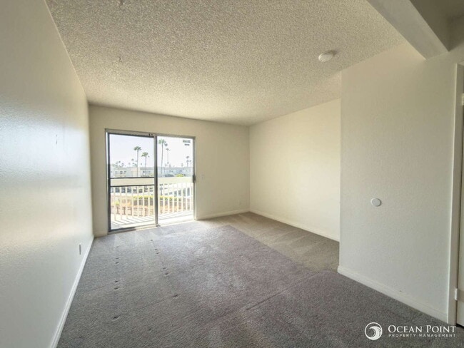 Building Photo - Charming 2 Bedroom Anacapa Condo just steps from the beach in Port Hueneme!
