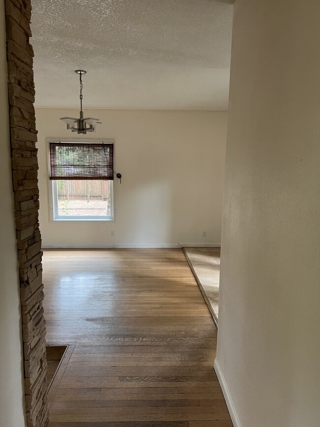 Living room with hardwood floors - 14212 SE River Rd