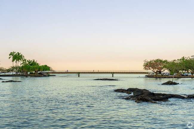 Watch the sunset from the shore of Hilo.