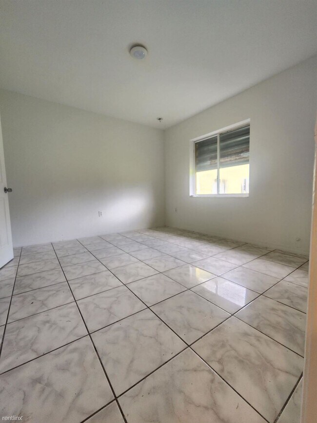 Building Photo - 4 br, 2 bath House - 7601 NW 20th Ave Exce...