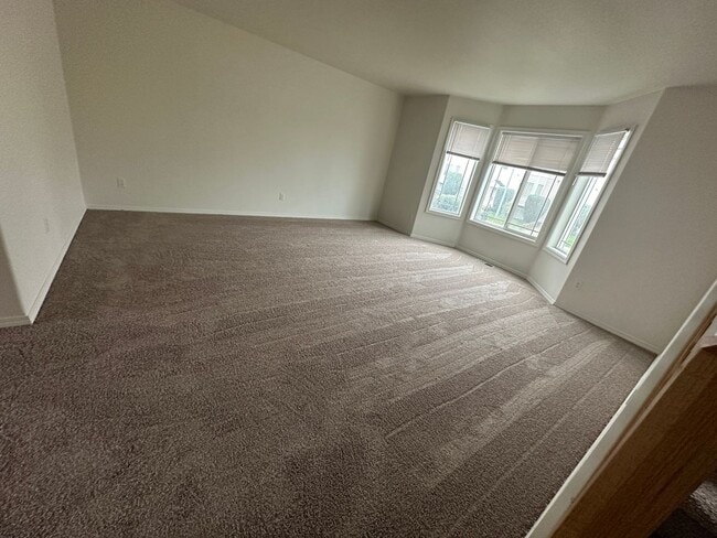 Building Photo - MOVE IN SPECIAL! Spacious 2 bed/2.5 bath with bonus room townhome off Road 68