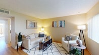 Located at 2925 Monument Blvd in Concord, California, this two-floor residence offers a functional and comfortable layout across its multiple levels. The living room provides a welcoming gathering space, featuring warm neutral-toned walls, textured ceilings, hardwood flooring, and ample room for seating. The dining area connects seamlessly to a pass-through kitchen, which is equipped with white cabinetry, a range, and overhead ventilation, making the space practical for everyday living and entertaining. Hardwood floors run throughout the main living areas, adding warmth and continuity.

The bedrooms are carpeted and present a calm, neutral palette. Several rooms feature sliding windows that allow natural light to fill the space and provide outdoor views. One bedroom includes direct access to a bathroom, offering added convenience. The bathrooms are finished with granite-style countertops, white cabinetry, and glass-enclosed tub-shower combinations with light wood-look flooring. A hallway landing area on the upper level connects the rooms and features a vanity with a granite countertop. Throughout the home, the textured ceilings, neutral walls, and consistent finishes create a cohesive and understated aesthetic suited for comfortable everyday living.