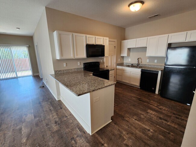 Building Photo - New Duplex - 2 Car Garage - Close to McCon...