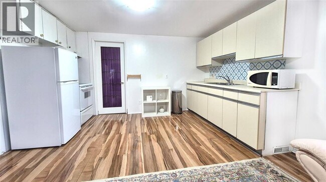 Photo du bâtiment - 201 St Rose Ave