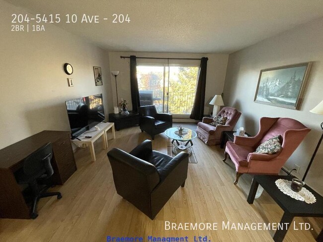 Photo du bâtiment - 204-5415 10 Ave