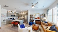 Located in Tyler, TX, this thoughtfully designed one-bedroom, one-bathroom residence offers an efficient and functional single-floor layout. The open-concept living and kitchen area forms the heart of the home, creating a seamless flow between cooking and relaxing spaces. The kitchen is outfitted with stainless steel appliances — including a refrigerator, dishwasher, microwave, and range — complemented by gray shaker-style cabinetry, granite countertops, and a center island with bar seating illuminated by pendant lighting. Wood-look flooring runs throughout the main living areas, adding warmth and continuity. The living room receives generous natural light through large windows dressed with blinds and curtains, and is finished with a ceiling fan overhead. The bedroom is a comfortable retreat featuring plush carpeting, a ceiling fan, a window for natural light, and access to a dedicated closet. The bathroom features a gray wood vanity with granite countertops, a large mirror with modern lighting, and wood-look flooring. The layout makes efficient use of every square foot, delivering a cohesive and well-finished living environment suited for comfortable day-to-day living.