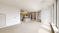 Located at 793 Main St in downtown Hartford, CT, this modern 2-bedroom, 2-bathroom residence offers a well-designed single-floor layout with clean architectural lines and an abundance of natural light. Dramatic floor-to-ceiling windows throughout the unit frame sweeping views of the Hartford cityscape, creating a bright and airy atmosphere in every room.

The open-concept kitchen and living area serves as the heart of the home. The kitchen is outfitted with light wood cabinetry, stainless steel appliances including a full-size refrigerator, built-in microwave, and dishwasher, complemented by rich dark countertops and a central island. Light tile flooring runs throughout the kitchen and transitions into plush carpet in the living and bedroom areas.

Both bedrooms are generously proportioned, featuring soft carpeting and large windows that invite natural light. The primary bedroom offers a comfortable and private retreat with notable window views.

The two bathrooms present distinct, modern designs. One features a full soaking tub with subway tile surround and a wall-mounted sink, while the second offers a sleek glass-enclosed walk-in shower, a wood-accented vanity, and large-format tile flooring. Both bathrooms reflect a minimalist, contemporary aesthetic consistent with the overall design of the residence.