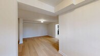 Located at 309 E 31st St in Baltimore, MD, this single-floor, three-bedroom, one-bathroom home offers a thoughtfully updated interior with a clean, modern aesthetic. Light-toned hardwood flooring runs throughout the main living areas and all three bedrooms, creating a bright and cohesive feel across the space.

The spacious primary bedroom is notably generous in size, featuring a built-in closet, a wall-mounted mini-split HVAC unit, and elegant ceiling light fixtures. The two additional bedrooms are well-proportioned, each with hardwood floors and access to natural light through windows overlooking the outdoors.

The kitchen is a standout feature, finished with striking marble-look porcelain tile flooring, navy cabinetry with gold hardware, stainless steel appliances including a gas range and over-range microwave, and dual windows that bring in natural light and outdoor views.

The bathroom continues the upscale material palette with floor-to-ceiling marble-look tile in the shower and tub surround, complemented by matching floor tile, delivering a refined and cohesive design.

A hallway and dedicated closet provide practical storage and circulation throughout the home. The overall ambiance is clean, modern, and move-in ready, with consistent finishes that create a polished and inviting living environment.