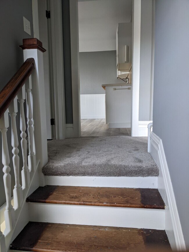 Top of stairway leading into hallway - 1053 Center St