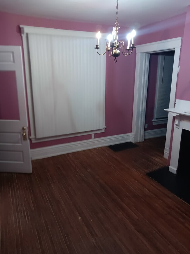 Cozy Sitting Rm w/decorative fireplace leading you to the Dining Rm - 2254 Whitney Ave