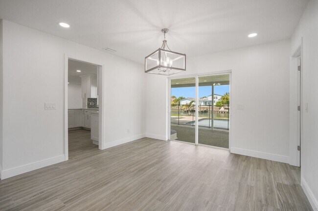 Building Photo - Stunning Waterfront 3BR/2BA Pool Home with...