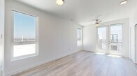 Located at 4555 30th Street in San Diego's lively North Park neighborhood, this modern studio offers a thoughtfully designed single-floor layout that maximizes every square foot. The living area is bright and airy, featuring light-toned hardwood-style flooring, crisp white walls, and clean-lined modern finishes throughout. Multiple windows flood the space with abundant natural light, while a ceiling fan adds both comfort and a contemporary touch. French doors open directly onto a private balcony, extending the living space outdoors and offering views of the surrounding neighborhood. The kitchen is sleek and functional, outfitted with dark cabinetry, white countertops, and stainless steel appliances including a refrigerator and dishwasher, creating a striking contrast against the light flooring. The entrance provides convenient access to a louvered-door closet, ideal for storage. The bathroom is finished with matching dark cabinetry, a white undermount sink with brushed nickel fixtures, a large mirror, a walk-in shower, and a privacy window that still allows natural light. The overall ambiance is clean, modern, and move-in ready, making this San Diego studio an efficient and stylish urban retreat.