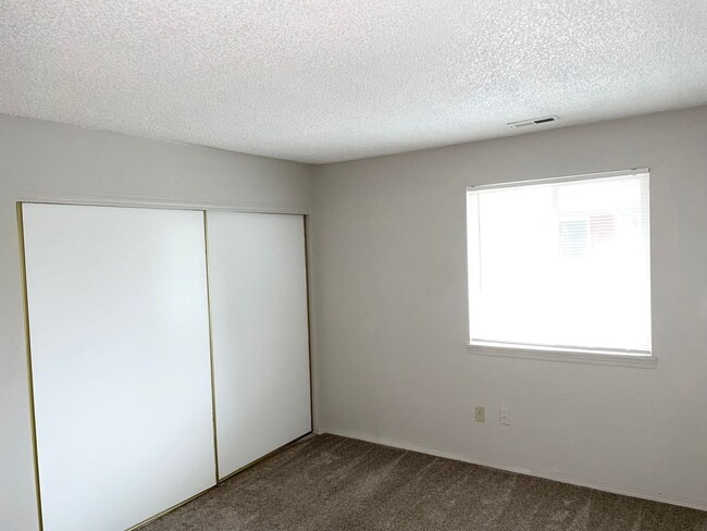 Building Photo - Cozy Second Story Condo Nestled in Gated C...