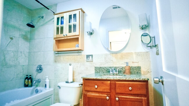 Bathroom with jacuzzi bathtub and marble finish - 6709 N Lakewood Ave