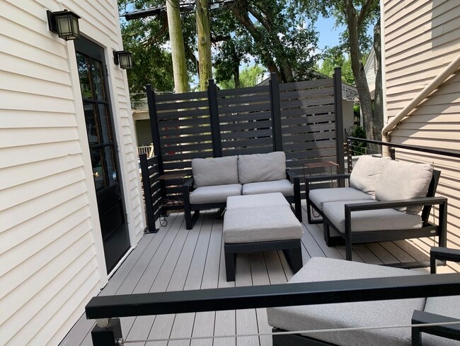 Outside deck opens onto a patio. - 1316 Pleasant St