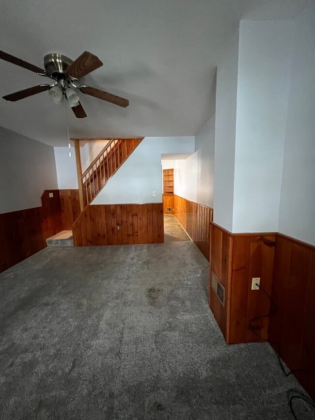 Living room view to dining room and staircase to second floor - 1419 Morling Ave