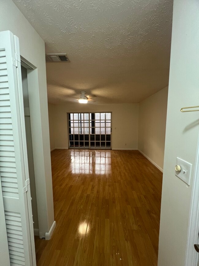 Entry way with coat closet looking into large living room - 5201 ATLANTIC Blvd