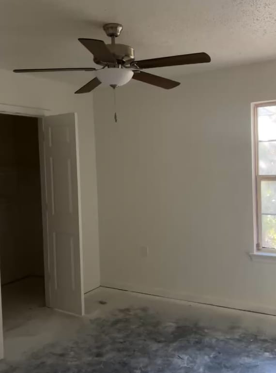 Spacious primary bedroom with roomy closet and modern ceiling fan. - 4720 Burma Rd