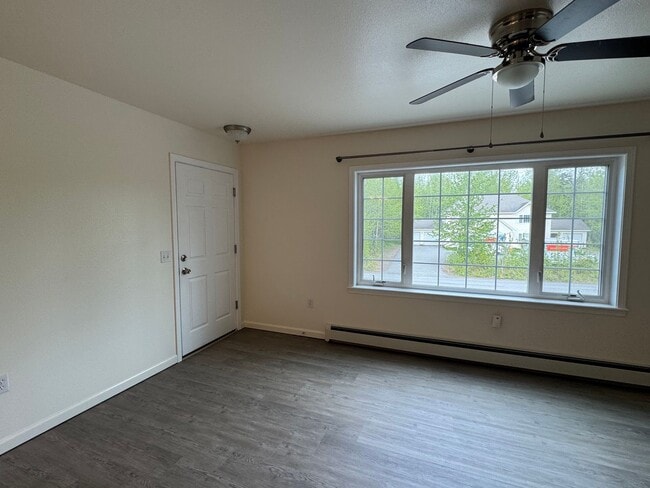 Building Photo - Heat included in this top floor unit with a garage!