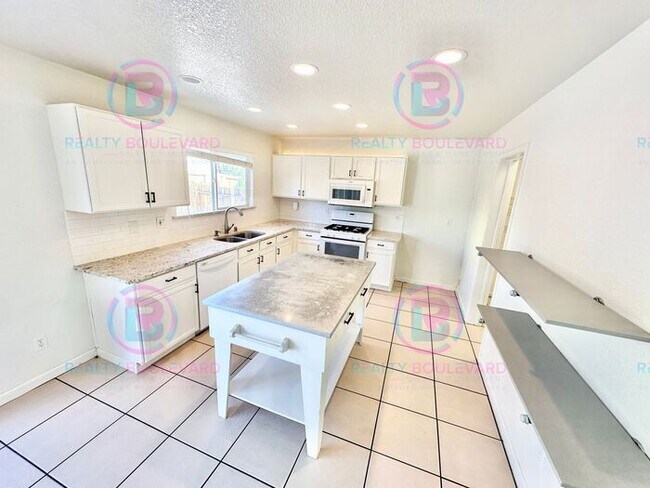 Building Photo - Gorgeous 4BR Home with Granite Counters, Open-Concept Living & 2 car garage