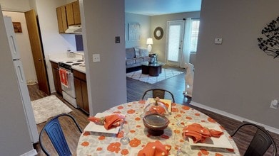 The dining area extends naturally from kitchen allowing easy movement between meal prep and dining. - Central Park Place