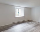 Step into a world of possibilities in this meticulously designed studio apartment. The 35 square meter space has been thoughtfully crafted to maximize both style and functionality, offering you a canvas to create your perfect urban retreat. As you enter, you're greeted by a flood of natural light streaming through the large window, illuminating the sleek, contemporary living area.

The heart of this home is the open-concept living space, where modern elegance meets practical design. The stunning wood-look flooring flows seamlessly throughout, adding warmth and sophistication to every corner. The cleverly designed layout allows for effortless transitions between living, dining, and sleeping areas, making it ideal for both relaxation and entertaining.

The kitchen, visible through a stylish pass-through window, boasts crisp white cabinetry and ample counter space, perfect for culinary enthusiasts or those who appreciate a well-organized cooking area. This thoughtful design element ensures that the kitchen remains connected to the main living space, promoting a sense of openness and facilitating easy conversation while preparing meals.

The bathroom is a sanctuary of relaxation, featuring a pristine white bathtub and modern fixtures. The clean lines and neutral palette create a spa-like atmosphere, offering a tranquil space to unwind after a long day.

This apartment isn't just a living space; it's a lifestyle choice. Its prime location at 228 - 27 Lucerne puts you at the heart of urban convenience, with easy access to local amenities, dining, and entertainment. Whether you're a young professional, a student, or someone looking to downsize without compromising on style, this studio apartment offers the perfect blend of comfort, functionality, and urban sophistication. Welcome to your new beginning in a space that truly inspires.