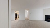 Located at 5029 Columbia Rd in Columbia, Maryland, this single-floor, three-bedroom, two-bathroom home offers a practical and comfortable layout. The living room serves as the heart of the space, featuring a classic fireplace with a black surround, neutral carpet flooring, and access to a patio through vertical-blind-covered sliding doors, allowing for natural light throughout.

The kitchen is equipped with wood-trimmed cabinetry in a cream finish, black appliances including a refrigerator, dishwasher, and electric range, and light tile flooring. A hallway connects the kitchen to the rest of the home seamlessly.

Each of the three bedrooms features plush carpet flooring and neutral wall tones. The primary bedroom is generously sized and includes an expansive built-in closet system with multiple bifold doors, providing ample storage. The secondary bedrooms are well-proportioned, with one featuring a window overlooking greenery outdoors, offering a bright and airy feel.

Both bathrooms are consistent in design, each featuring a full tub-shower combination with white tile surround, a vanity with storage, and the same light tile flooring found in the kitchen. A connecting hallway ties all rooms together, contributing to an efficient and cohesive floor plan throughout the home.