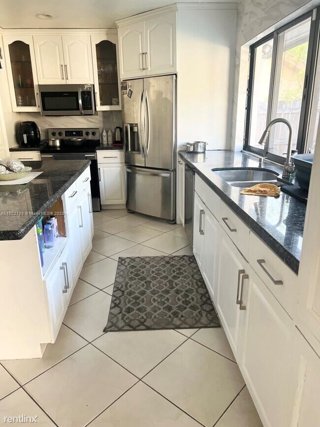Foto del edificio - 4 br, 2 bath House - 7363 NW 49th Ct # 7363