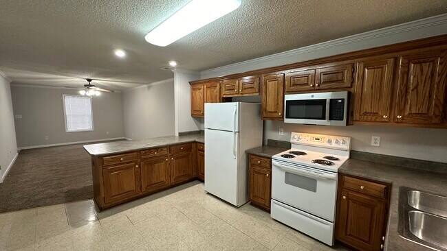 Kitchen has lots of cabinet storage. - 1211 Goldridge Dr SW