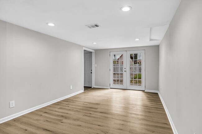 Living room flushed with natural light from French doors - 844 E 37th St