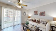 This well-appointed one-bedroom, one-bathroom residence in Chesterfield, MO offers a thoughtfully organized single-floor layout with a warm, comfortable ambiance throughout. The living room serves as the heart of the home, showcasing wood-style plank flooring, a ceiling fan with light fixture, a classic fireplace with a white mantel, and a sliding glass door that opens to a private balcony, allowing natural light to fill the space. Adjacent to the living area, the dining room features chair-rail molding and hardwood-style flooring, creating an elegant yet casual setting for meals. The kitchen is designed with a peninsula breakfast bar, dark granite-style countertops, warm wood cabinetry, stainless steel appliances, and a smooth flow into the main living and dining areas. The spacious primary bedroom is carpeted for comfort and includes a large window with sheer drapes, a textured ceiling, and access to a dedicated closet. The full bathroom offers wood-style flooring, a wide vanity with generous counter space, warm cabinetry, a large mirror, and a tub-shower combination. Textured ceilings are consistent throughout the residence, adding a classic architectural detail to every room.