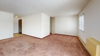 This 910 square foot apartment in Waukesha, WI offers a practical and comfortable living space. The unit features two bedrooms, including a primary bedroom of 160 square feet, and two full bathrooms. The kitchen is equipped with essential appliances, including a refrigerator and stove, and boasts ample wood cabinetry and counter space. The living areas are carpeted throughout, providing a cozy atmosphere. Large windows in the living room and bedrooms allow for natural light, while sliding glass doors lead to an outdoor space. The bathrooms are fitted with standard fixtures, including a bathtub in at least one. Storage is plentiful with built-in closets featuring louvered doors. Baseboard heating ensures comfort year-round. The neutral color palette and simple design make this apartment a blank canvas for personalization. While not luxurious, this apartment offers functional living space suitable for small families or individuals seeking a no-frills home in a convenient location.