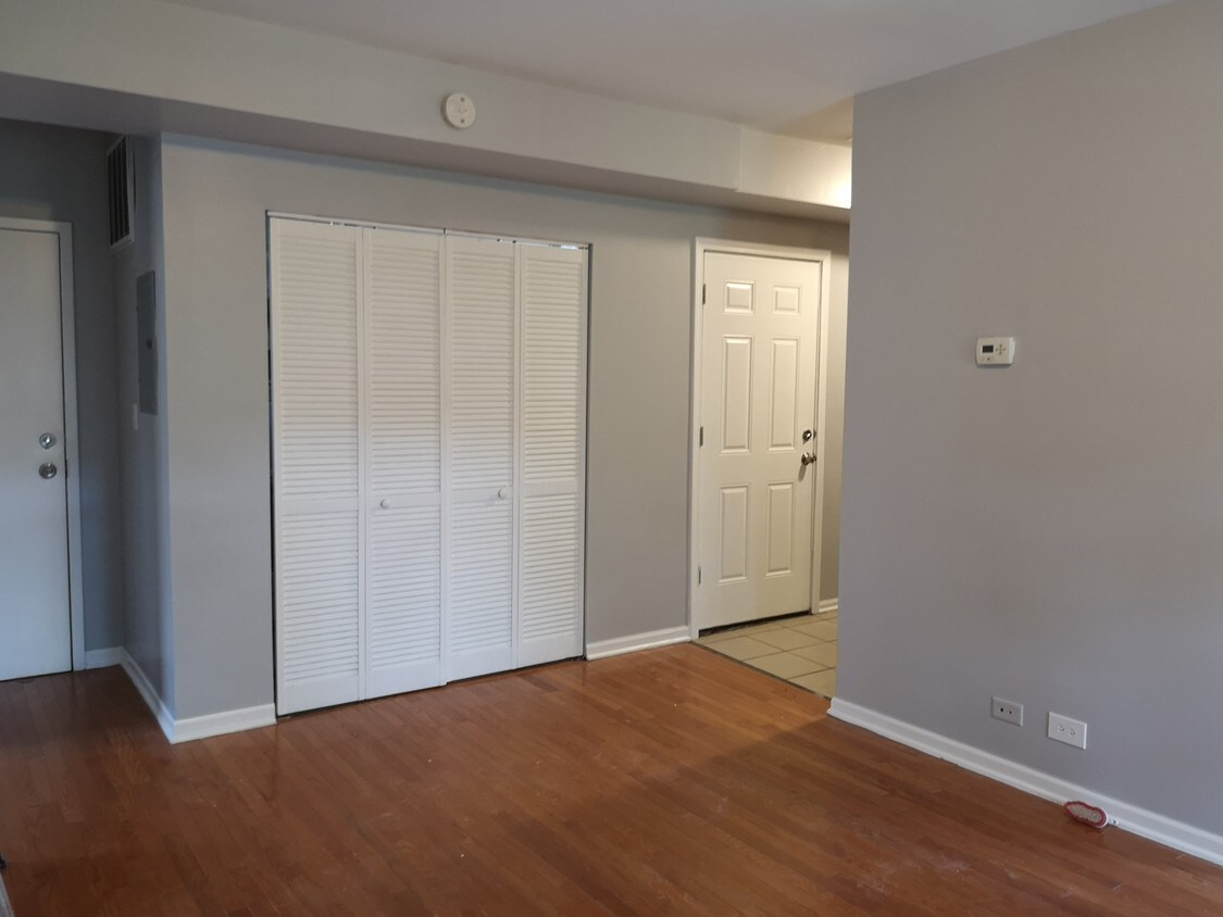 Living room with kitchen nook - 7423 S Kimbark Ave