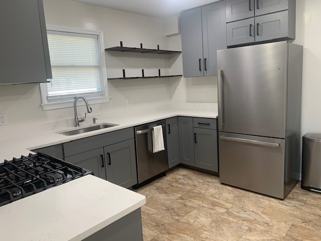 Newly renovated kitchen with open shelving. - 21 Oak Rd