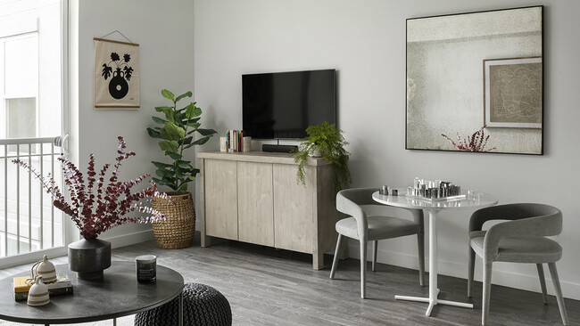 Apartment Living and Dining area with wood floors. - Griffis Cheesman Park