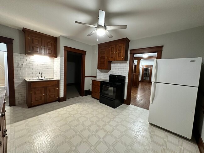 Kitchen with new granite counters and tile backsplash - 73 2nd Ave