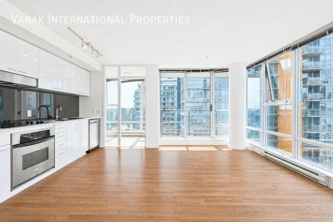 Photo du bâtiment - 2 Bed + Den + Solarium | 2 Bath | Parking | Spectrum