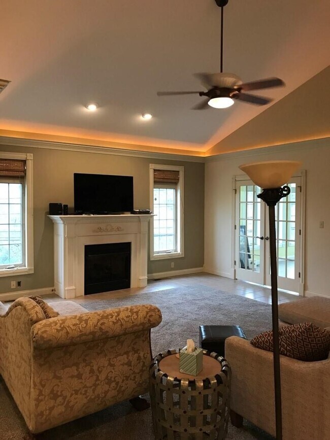 Livingroom Fireplace and Sun room - 37 Melrose Dr