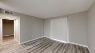 Located at 350 Bryant Rd in Spartanburg, SC, this one-bedroom, one-bathroom unit offers a well-organized single-floor layout designed for efficient, comfortable living. Throughout the space, durable wood-look plank flooring and neutral warm-gray walls create a clean, cohesive aesthetic, complemented by white baseboards and textured ceilings.

The living areas are bright and open, with large windows dressed in vertical and horizontal blinds that allow natural light to filter in. The layout includes two defined living spaces, providing flexibility for a dedicated lounge and dining area.

The kitchen is outfitted with white shaker-style cabinetry, light stone-finish countertops, and stainless steel appliances including a refrigerator and an electric range with overhead ventilation — a practical and modern setup for everyday cooking.

The bedroom is a generously sized private retreat featuring a closet with a full-panel door and direct access to the hallway. The bathroom includes a single-sink vanity with white cabinetry, a framed mirror, and a tiled shower-tub combination, all finished with consistent wood-look flooring for a unified look.

A hallway connects the living and sleeping areas, with additional closet storage completing the thoughtfully planned interior of this move-in-ready Spartanburg residence.