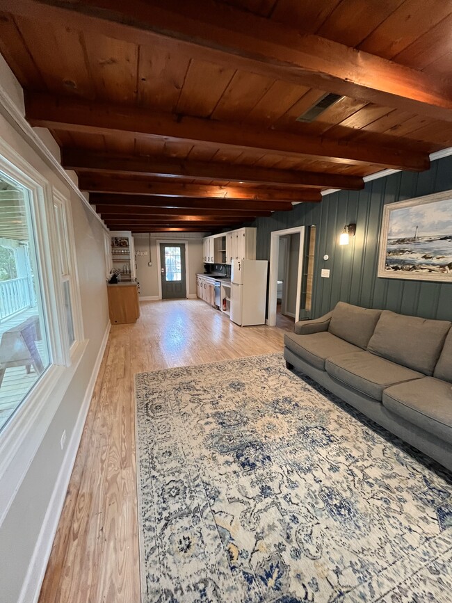 Long kitchen and living room layout. A rectangular table and 4 chairs is perfect to divide the space - 302 Norton St