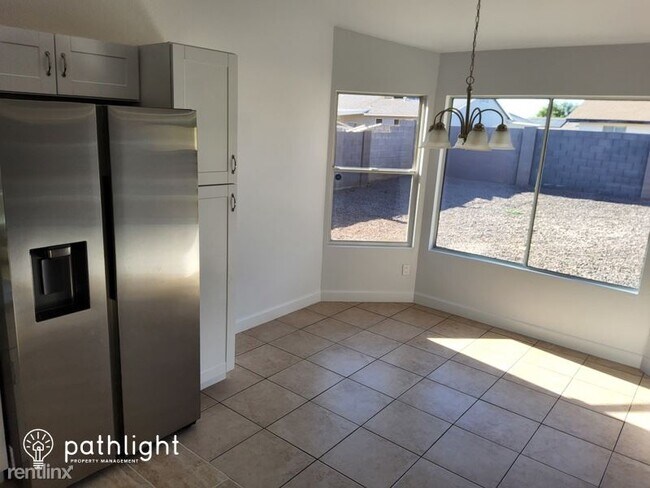 Building Photo - 4 br, 2 bath House - 8520 W Roma Avenue UNIT