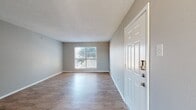 This well-designed apartment at Addison Apartments At The Park 1 offers a generous 800 square feet of living space on a single floor. The layout includes three bedrooms, with the primary bedroom boasting an impressive 230 square feet. The apartment features one bathroom and two kitchen areas, providing convenience for multiple occupants.

Throughout the space, warm-toned hardwood flooring creates a welcoming atmosphere, complemented by neutral wall colors that allow for personalization. Large windows in each room flood the apartment with natural light, enhancing the sense of spaciousness. Ceiling fans in the bedrooms offer additional comfort and air circulation.

The kitchen areas are equipped with modern appliances, including a stainless steel refrigerator and stove. Granite countertops and white cabinetry provide both style and functionality. The bathroom features a clean, simple design with a white vanity and mirror.

Storage is ample with two closet spaces, perfect for organizing personal belongings. The open floor plan in the main living area allows for flexible furniture arrangements and easy flow between spaces.

This apartment combines practicality with comfort, making it an ideal choice for families or individuals seeking a spacious, well-appointed living environment. The neutral palette and modern fixtures provide a blank canvas for residents to create their perfect home.
