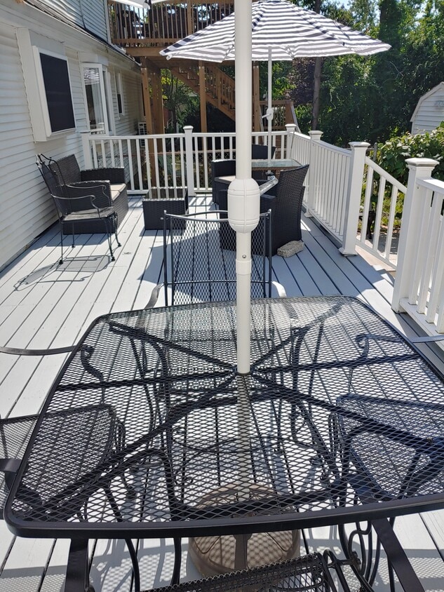 one of two decks and patio area fully furnished with stored pillows - 623 Old West Central St