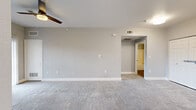 This contemporary 630 square foot apartment in Colorado Springs offers a thoughtfully designed living space. The open-concept layout seamlessly integrates the kitchen, living, and dining areas, creating a spacious feel. The kitchen boasts modern white cabinetry, granite countertops, and stainless steel appliances, including a French door refrigerator and built-in microwave.

The bedroom, measuring 130 square feet, features plush carpeting and dual windows that flood the space with natural light. A sliding glass door in the living area leads to a private balcony, providing stunning views of the surrounding landscape.

The bathroom showcases a clean, white design with a tub-shower combination and wood-look flooring. Throughout the apartment, neutral gray walls and white trim create a fresh, contemporary aesthetic. Ample closet space and additional storage options contribute to the unit's functionality.

The apartment's strategic layout maximizes every square foot, offering a harmonious blend of style and practicality. With its modern amenities and thoughtful design, this one-bedroom apartment presents an ideal living solution for those seeking comfort and convenience in Colorado Springs.