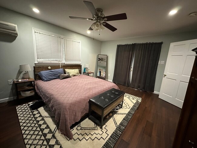Primary bedroom, shown with doors that lead to outdoor patio - 838 Colvin Ct