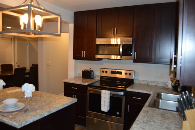 Kitchen/living room space is open and inviting for entertaining. - 828 Young's Lane